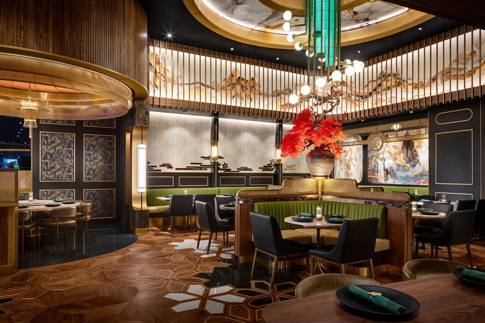 Elegant dining area of Emerald Chinese Cuisine featuring modern Asian-inspired design with intricate wood flooring, green seating booths, and bold red floral centerpiece.